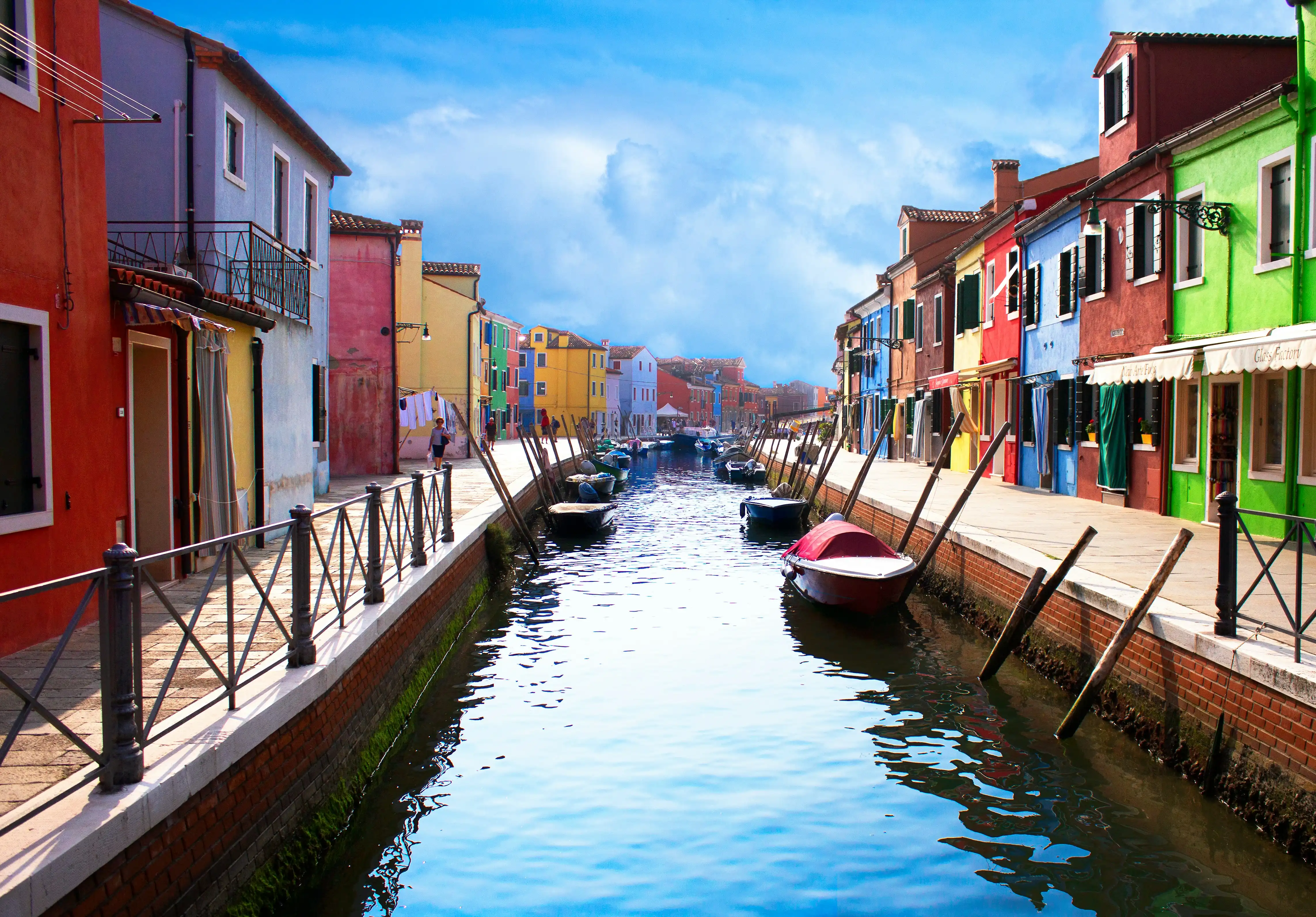 A row of houses along a canal in Murano, Italy
